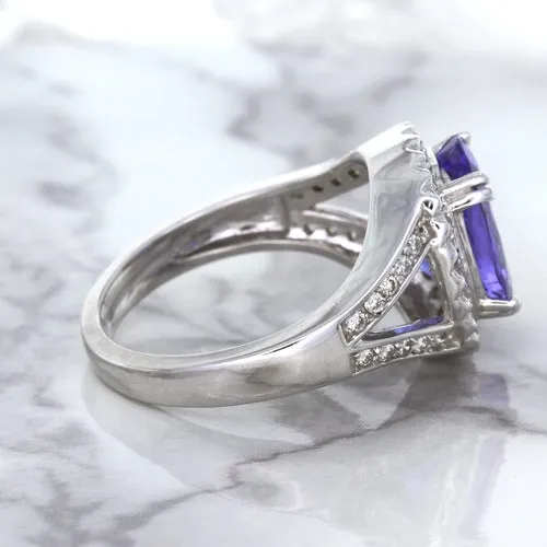3.37ct Oval Tanzanite Ring with Diamond Halo in 14K White Gold