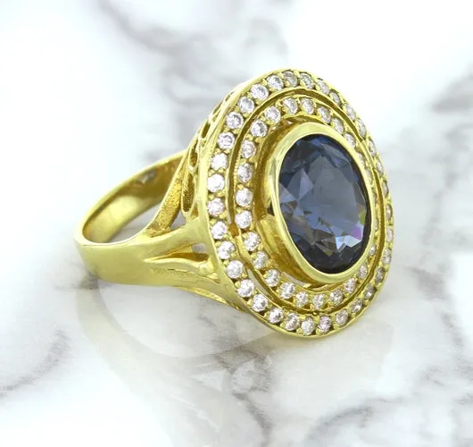 4.23ct Oval Blue Spinel Ring with Double Diamond Halo in 14K Yellow Gold