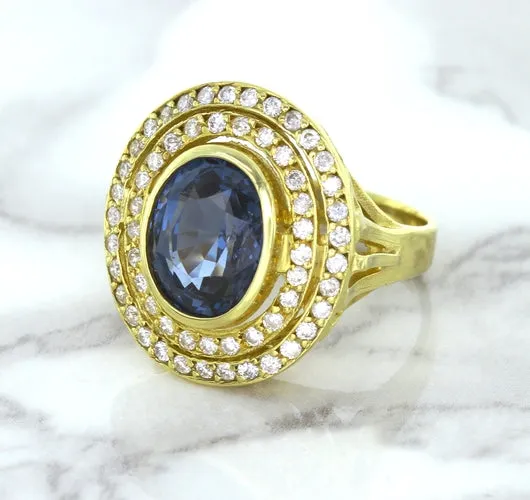 4.23ct Oval Blue Spinel Ring with Double Diamond Halo in 14K Yellow Gold
