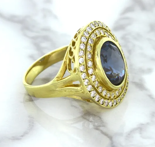 4.23ct Oval Blue Spinel Ring with Double Diamond Halo in 14K Yellow Gold