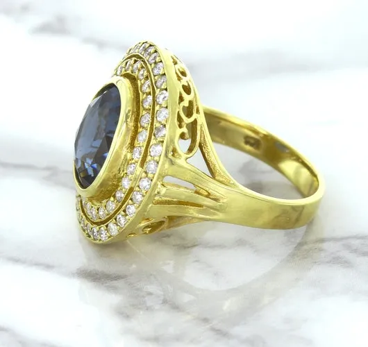 4.23ct Oval Blue Spinel Ring with Double Diamond Halo in 14K Yellow Gold