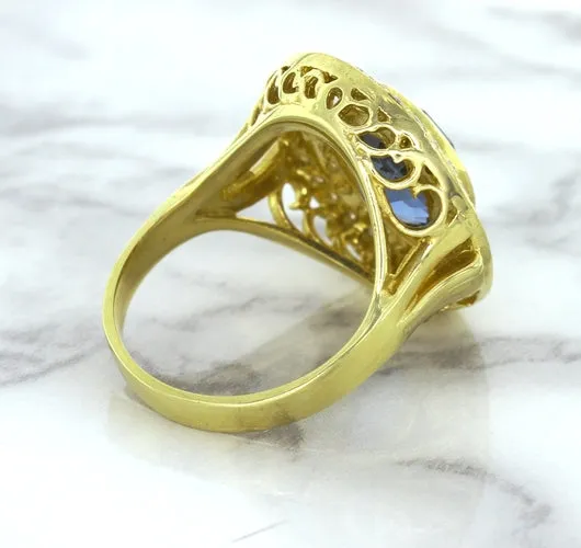 4.23ct Oval Blue Spinel Ring with Double Diamond Halo in 14K Yellow Gold