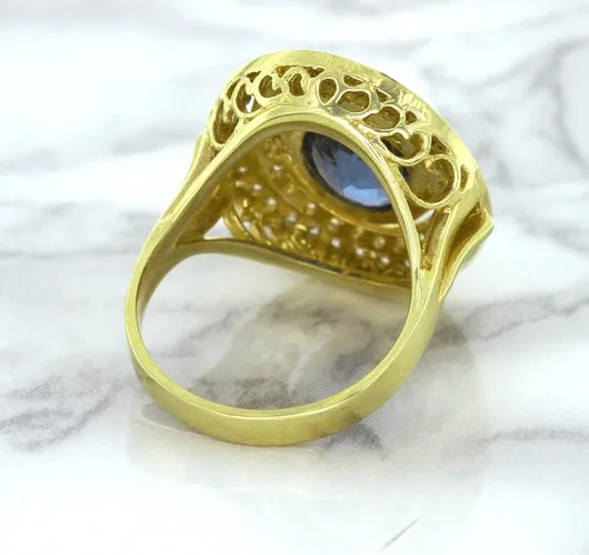 4.23ct Oval Blue Spinel Ring with Double Diamond Halo in 14K Yellow Gold