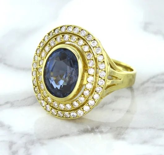 4.23ct Oval Blue Spinel Ring with Double Diamond Halo in 14K Yellow Gold
