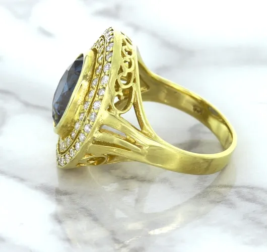 4.23ct Oval Blue Spinel Ring with Double Diamond Halo in 14K Yellow Gold