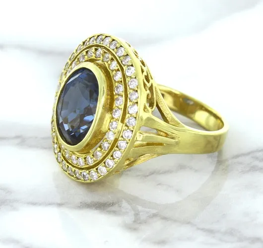 4.23ct Oval Blue Spinel Ring with Double Diamond Halo in 14K Yellow Gold