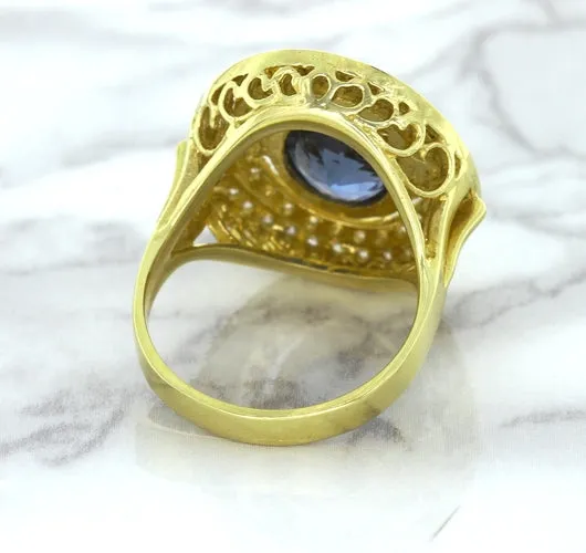 4.23ct Oval Blue Spinel Ring with Double Diamond Halo in 14K Yellow Gold