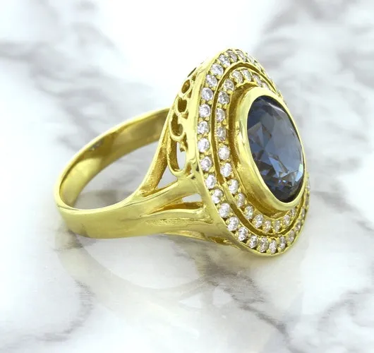 4.23ct Oval Blue Spinel Ring with Double Diamond Halo in 14K Yellow Gold