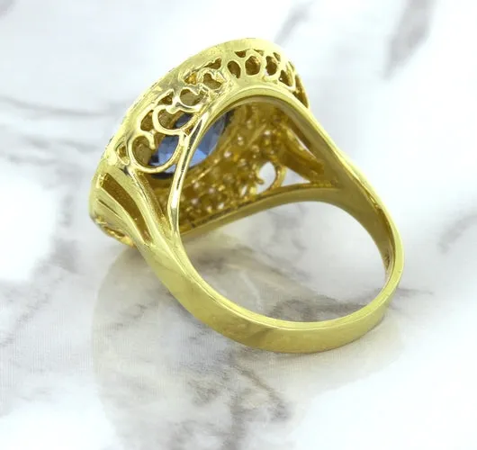4.23ct Oval Blue Spinel Ring with Double Diamond Halo in 14K Yellow Gold