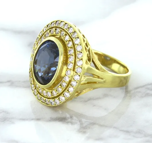 4.23ct Oval Blue Spinel Ring with Double Diamond Halo in 14K Yellow Gold