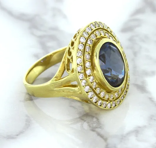 4.23ct Oval Blue Spinel Ring with Double Diamond Halo in 14K Yellow Gold