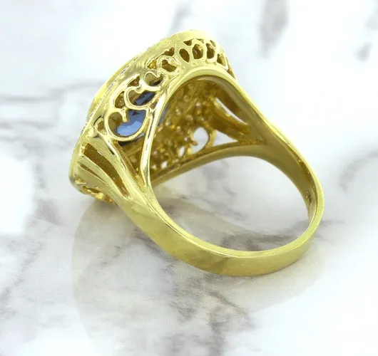 4.23ct Oval Blue Spinel Ring with Double Diamond Halo in 14K Yellow Gold