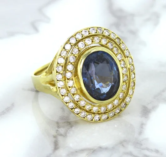 4.23ct Oval Blue Spinel Ring with Double Diamond Halo in 14K Yellow Gold