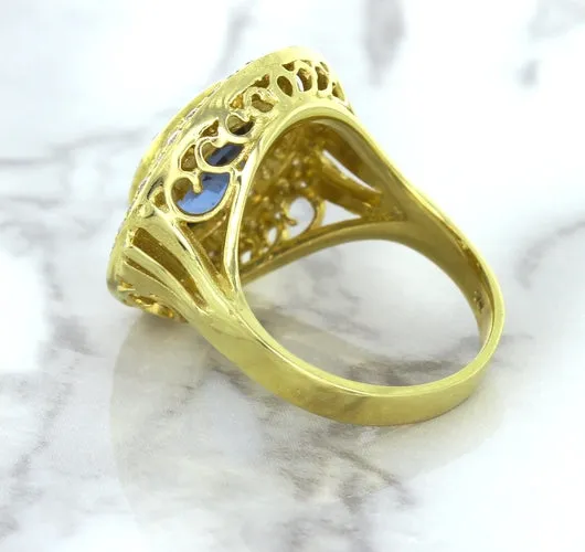 4.23ct Oval Blue Spinel Ring with Double Diamond Halo in 14K Yellow Gold