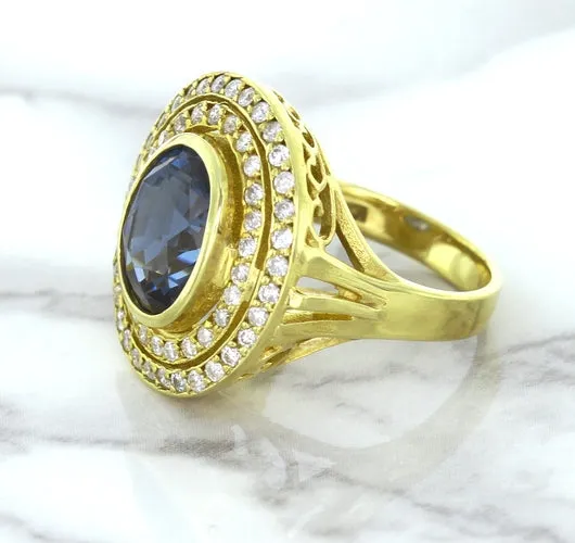4.23ct Oval Blue Spinel Ring with Double Diamond Halo in 14K Yellow Gold