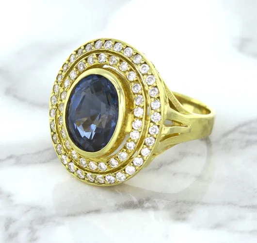 4.23ct Oval Blue Spinel Ring with Double Diamond Halo in 14K Yellow Gold