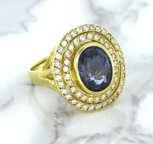 4.23ct Oval Blue Spinel Ring with Double Diamond Halo in 14K Yellow Gold