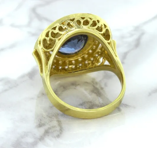 4.23ct Oval Blue Spinel Ring with Double Diamond Halo in 14K Yellow Gold
