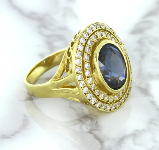 4.23ct Oval Blue Spinel Ring with Double Diamond Halo in 14K Yellow Gold