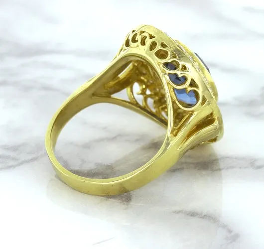 4.23ct Oval Blue Spinel Ring with Double Diamond Halo in 14K Yellow Gold