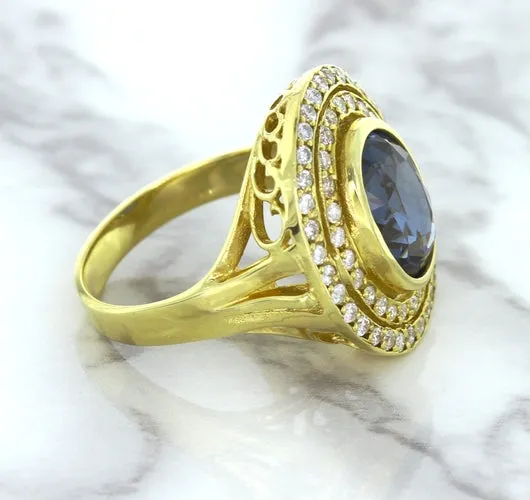 4.23ct Oval Blue Spinel Ring with Double Diamond Halo in 14K Yellow Gold