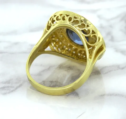 4.23ct Oval Blue Spinel Ring with Double Diamond Halo in 14K Yellow Gold