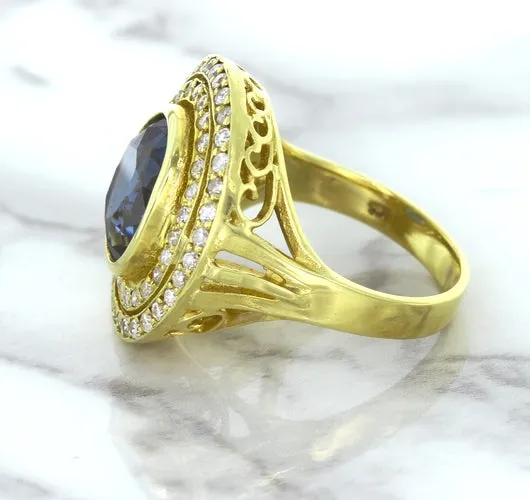 4.23ct Oval Blue Spinel Ring with Double Diamond Halo in 14K Yellow Gold