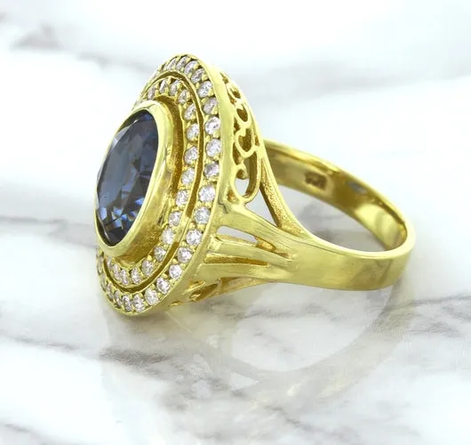 4.23ct Oval Blue Spinel Ring with Double Diamond Halo in 14K Yellow Gold