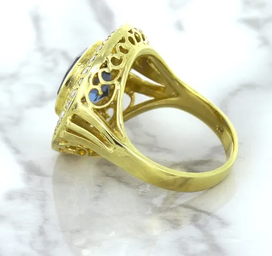 4.23ct Oval Blue Spinel Ring with Double Diamond Halo in 14K Yellow Gold