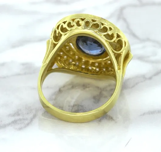 4.23ct Oval Blue Spinel Ring with Double Diamond Halo in 14K Yellow Gold