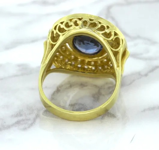 4.23ct Oval Blue Spinel Ring with Double Diamond Halo in 14K Yellow Gold