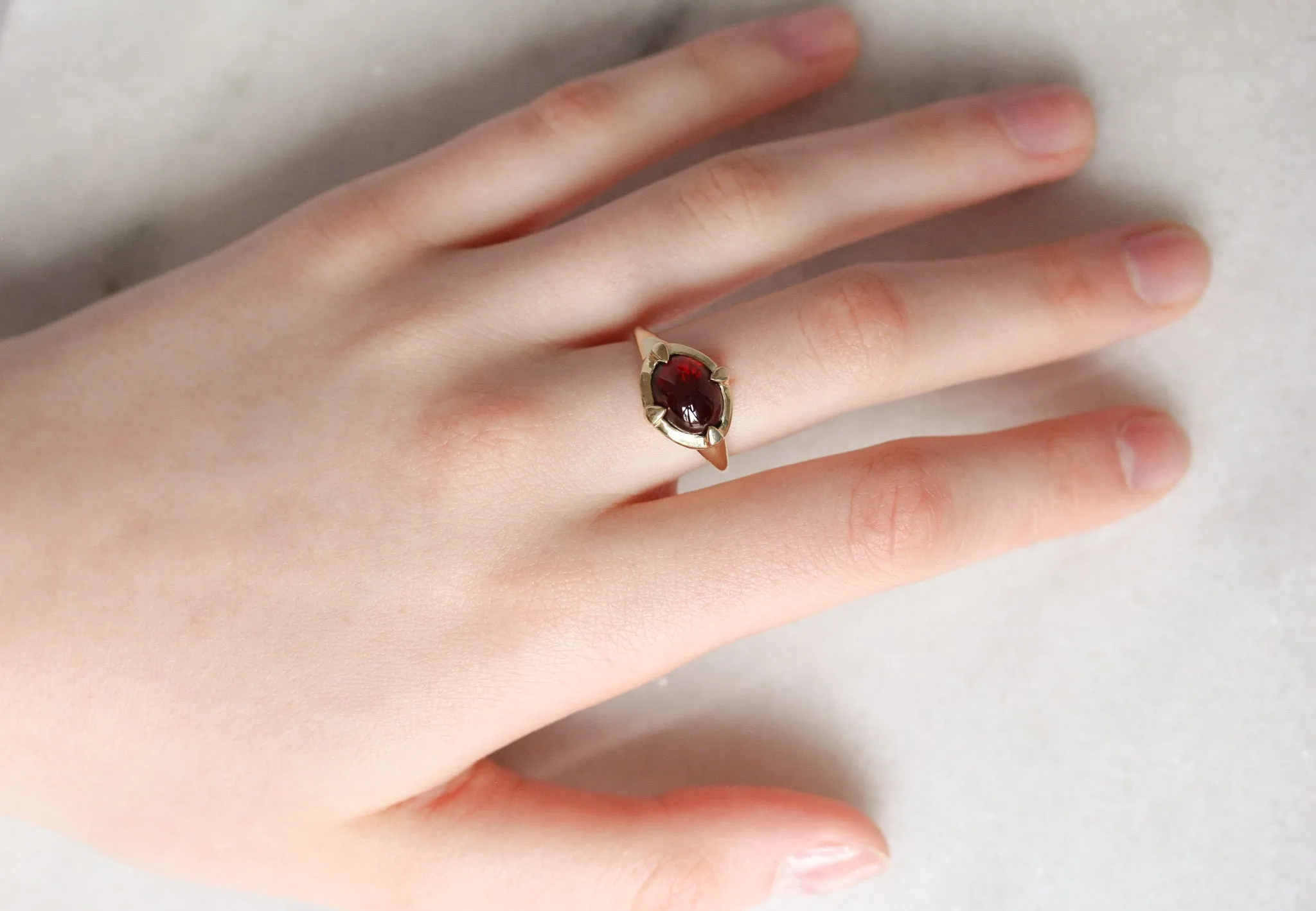 Garnet "En Cabochon" Claw Ring