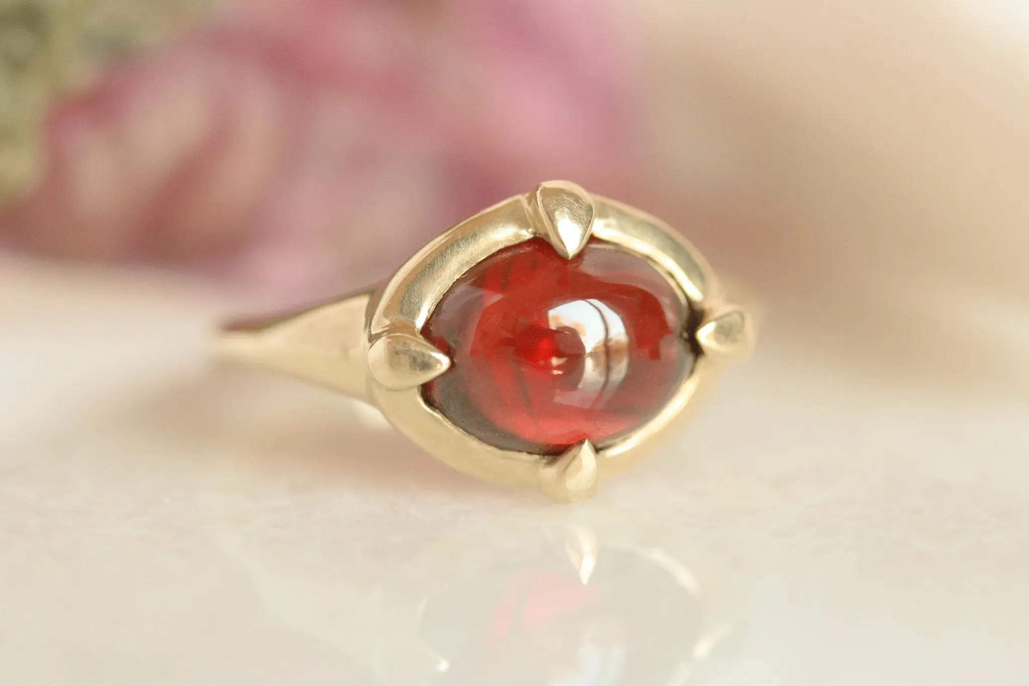 Garnet "En Cabochon" Claw Ring